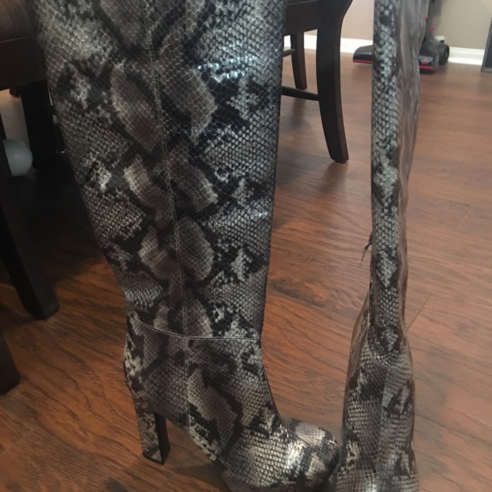 Snake print knee high boots